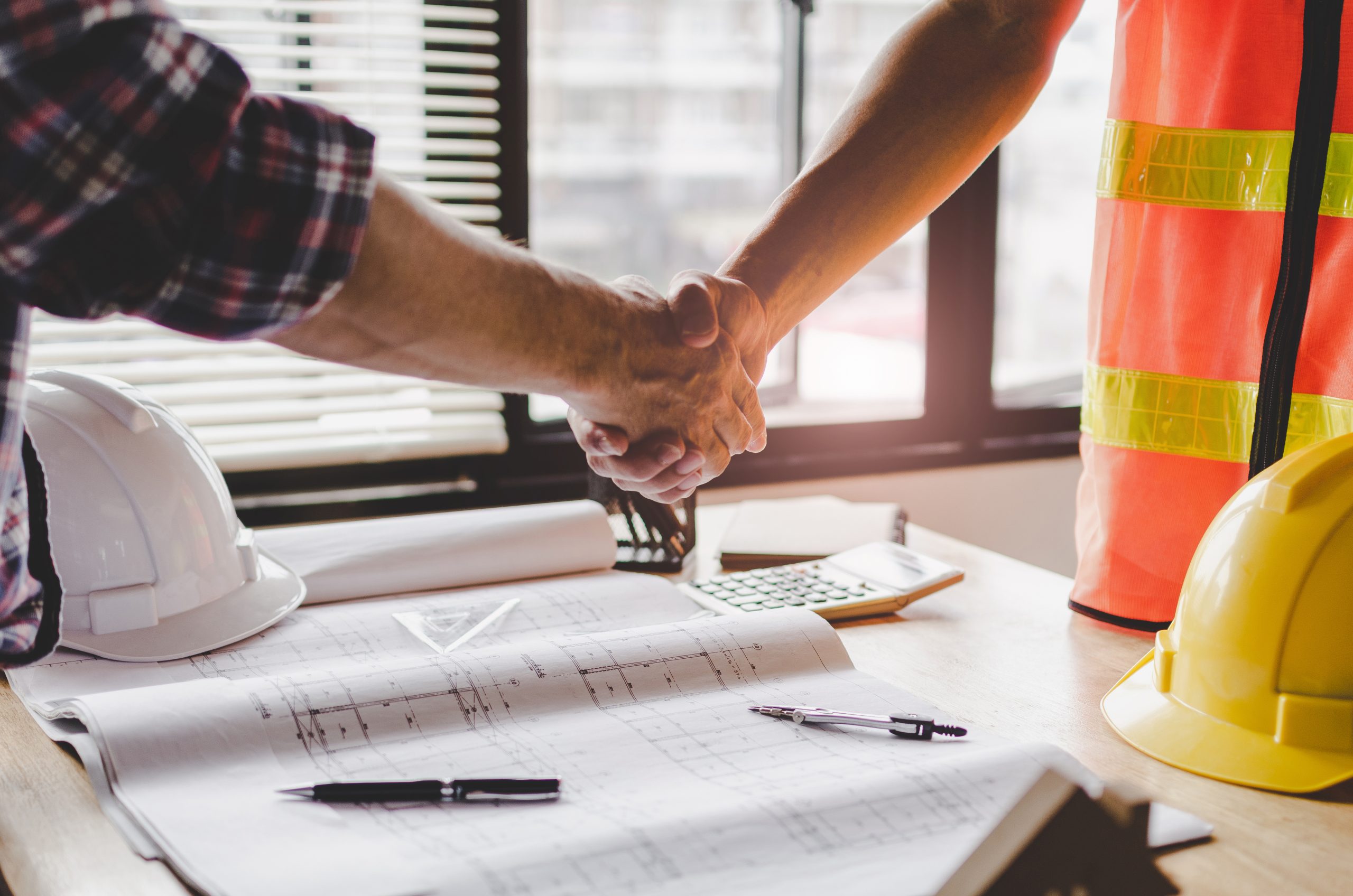 et-construction-worker-team-hands-shaking-AdobeStock_247567127.-2022-11-09